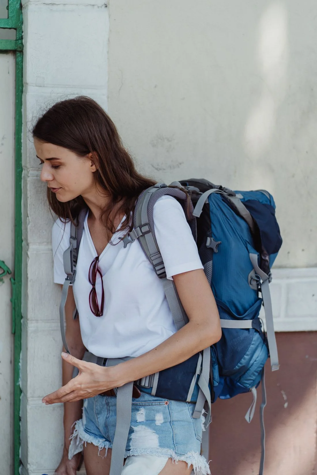 Woman traveler carrying a backpack outdoors